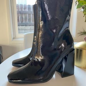 New misguided booties in black patent.